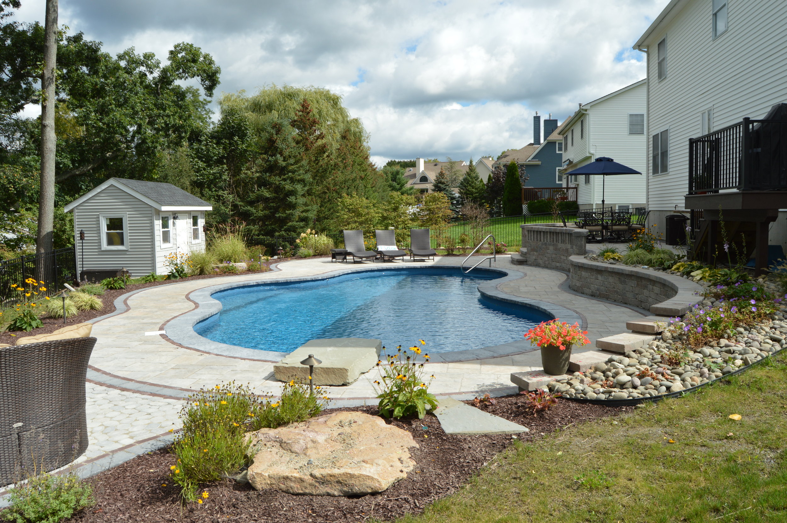 Can you explain the difference between hardscape and softscape in landscaping?